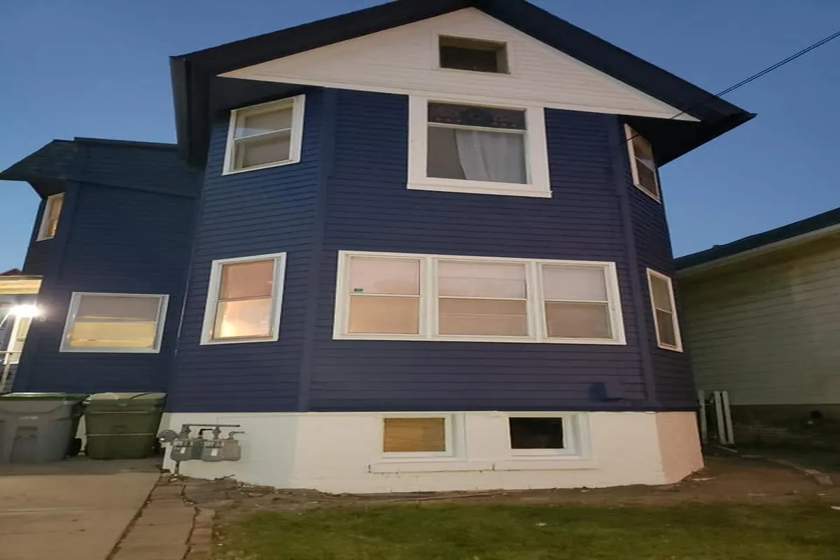 Residential two story home exterior after a full blue repaint